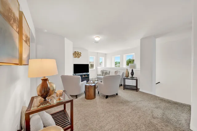 a kitchen with stainless steel appliances granite countertop a stove top oven a sink dishwasher and a refrigerator