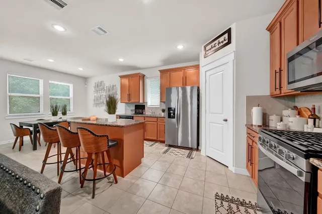 a bedroom with a large bed and flat tv