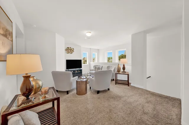 a kitchen with granite countertop stainless steel appliances a sink a refrigerator a stove and a cabinets