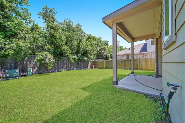 a view of a house with a back yard