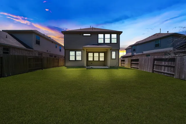 an aerial view of a house with a garden