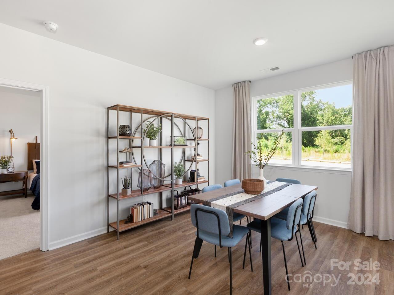 63 Dandelion Road Fletcher, NC 28732 - Photo 11 of 27 a view of a dining room with furniture window and wooden floor