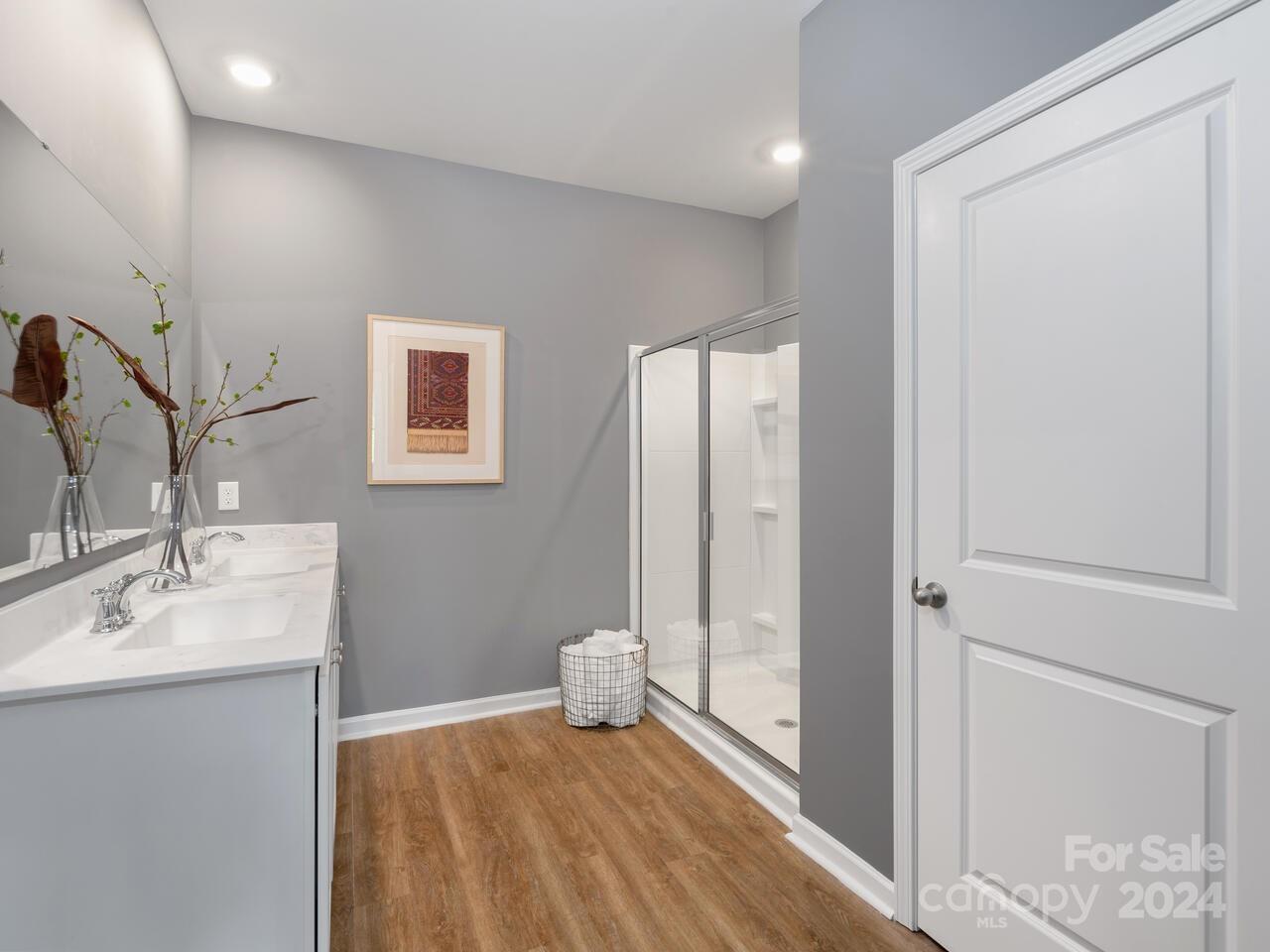 63 Dandelion Road Fletcher, NC 28732 - Photo 18 of 27 a bathroom with a sink and a mirror