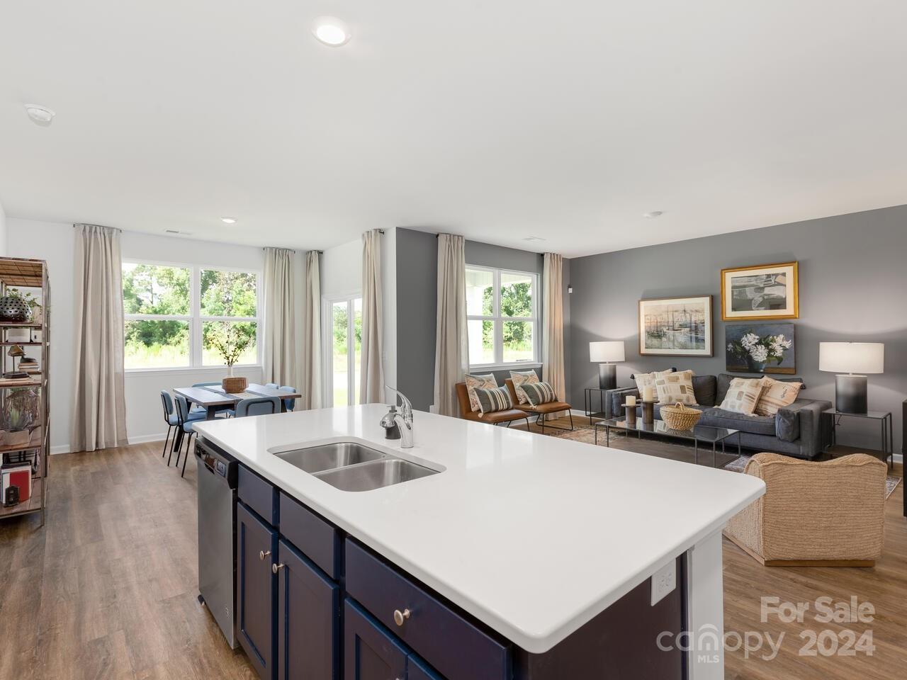 63 Dandelion Road Fletcher, NC 28732 - Photo 9 of 27 a view of a kitchen island a sink a window and a living room in it