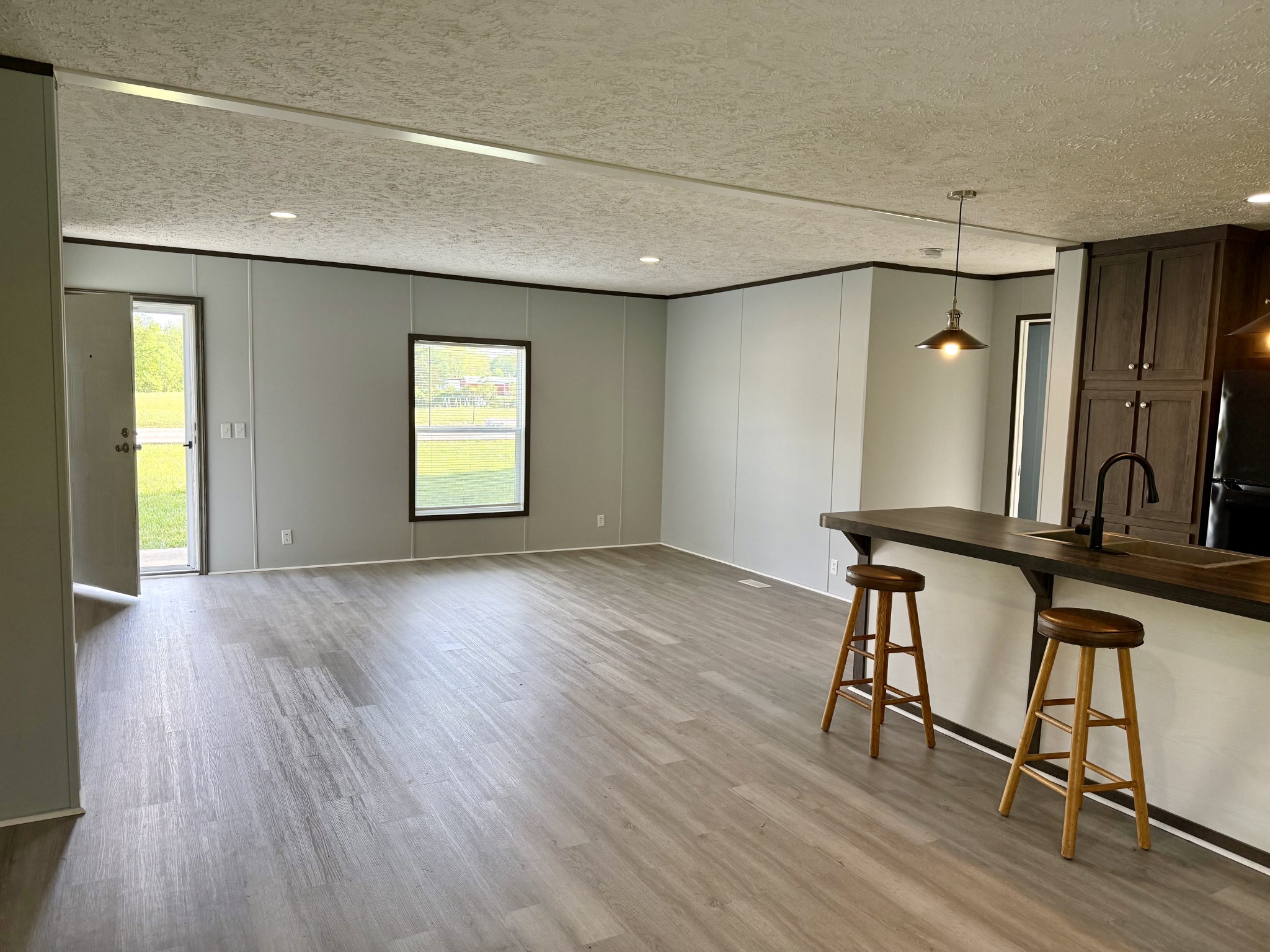 532 Pointe Lane Lafayette, TN 37083 - Photo 3 of 11 a view of an empty room with window and wooden floor