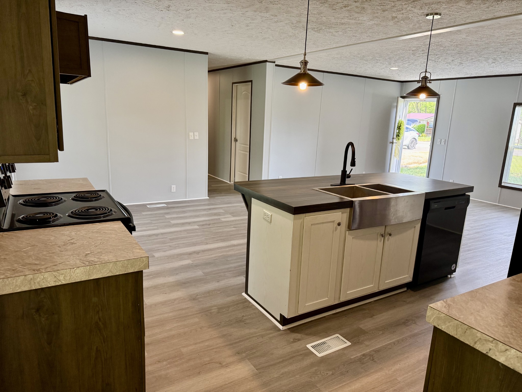 532 Pointe Lane Lafayette, TN 37083 - Photo 4 of 11 a kitchen with stainless steel appliances granite countertop a stove and a sink