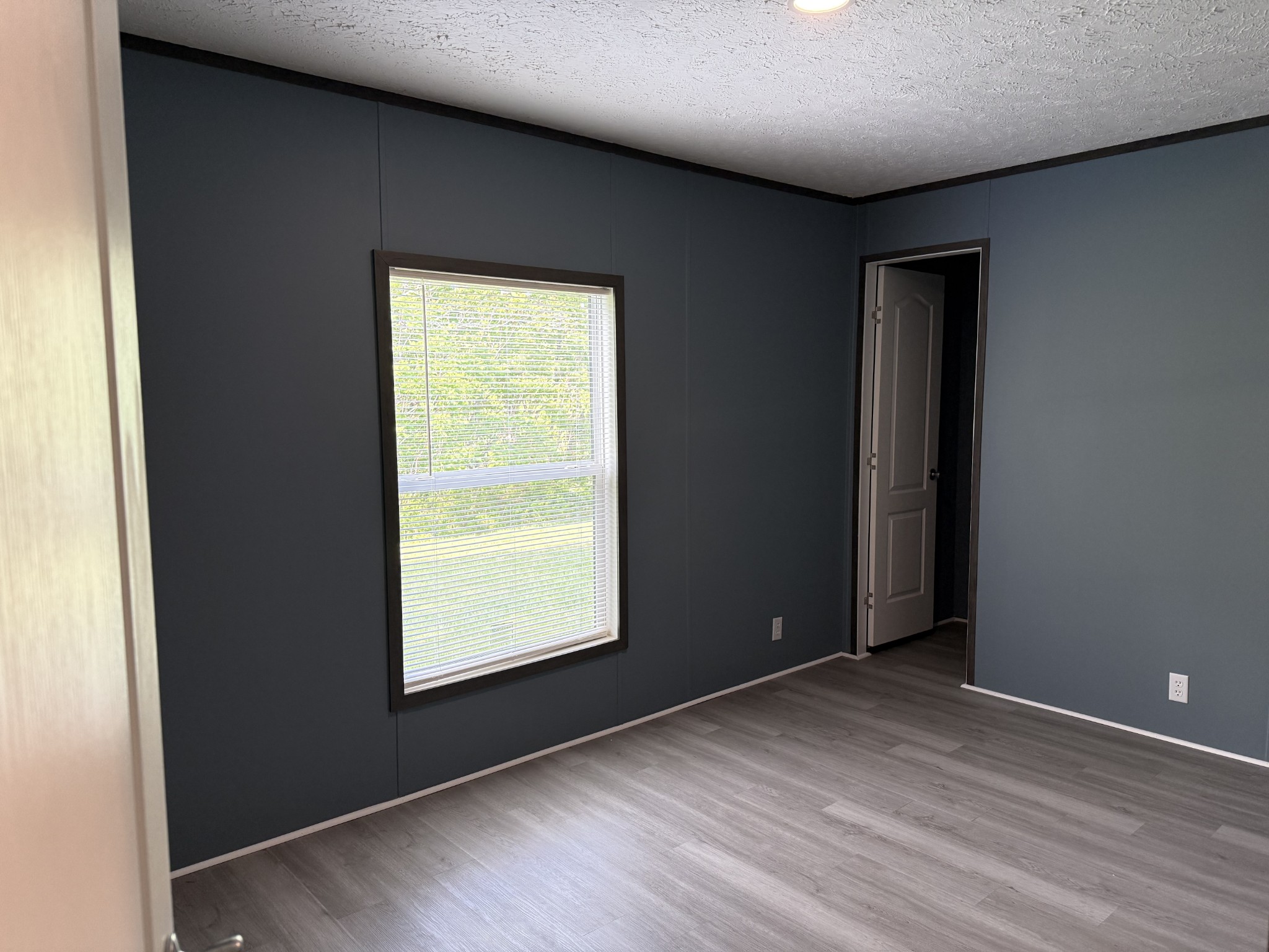532 Pointe Lane Lafayette, TN 37083 - Photo 7 of 11 an empty room with wooden floor and windows