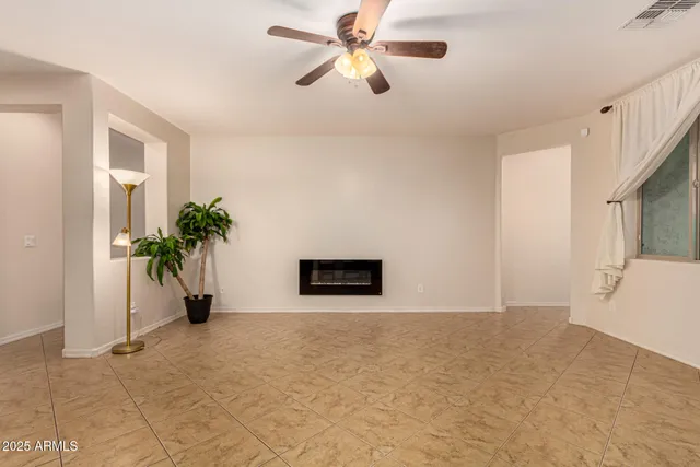 a large kitchen with a table and chairs