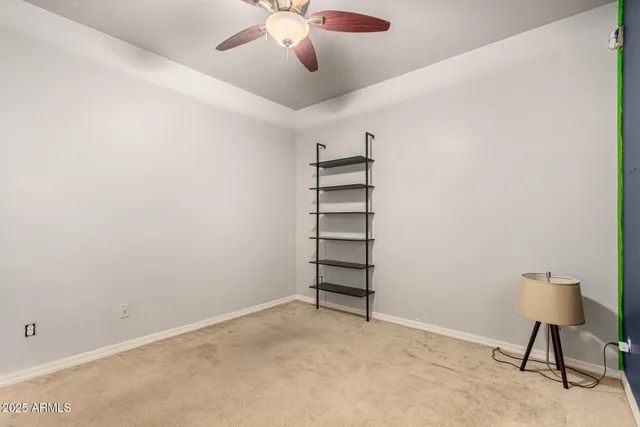 a bathroom with a granite countertop sink toilet a shower and a mirror