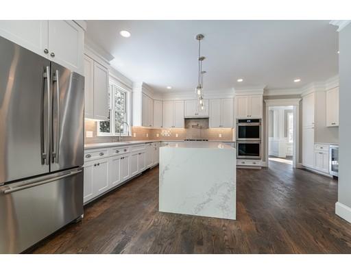 22 Richard Road Needham, MA 02492 - Photo 4 of 30 a kitchen with refrigerator cabinets and wooden floor