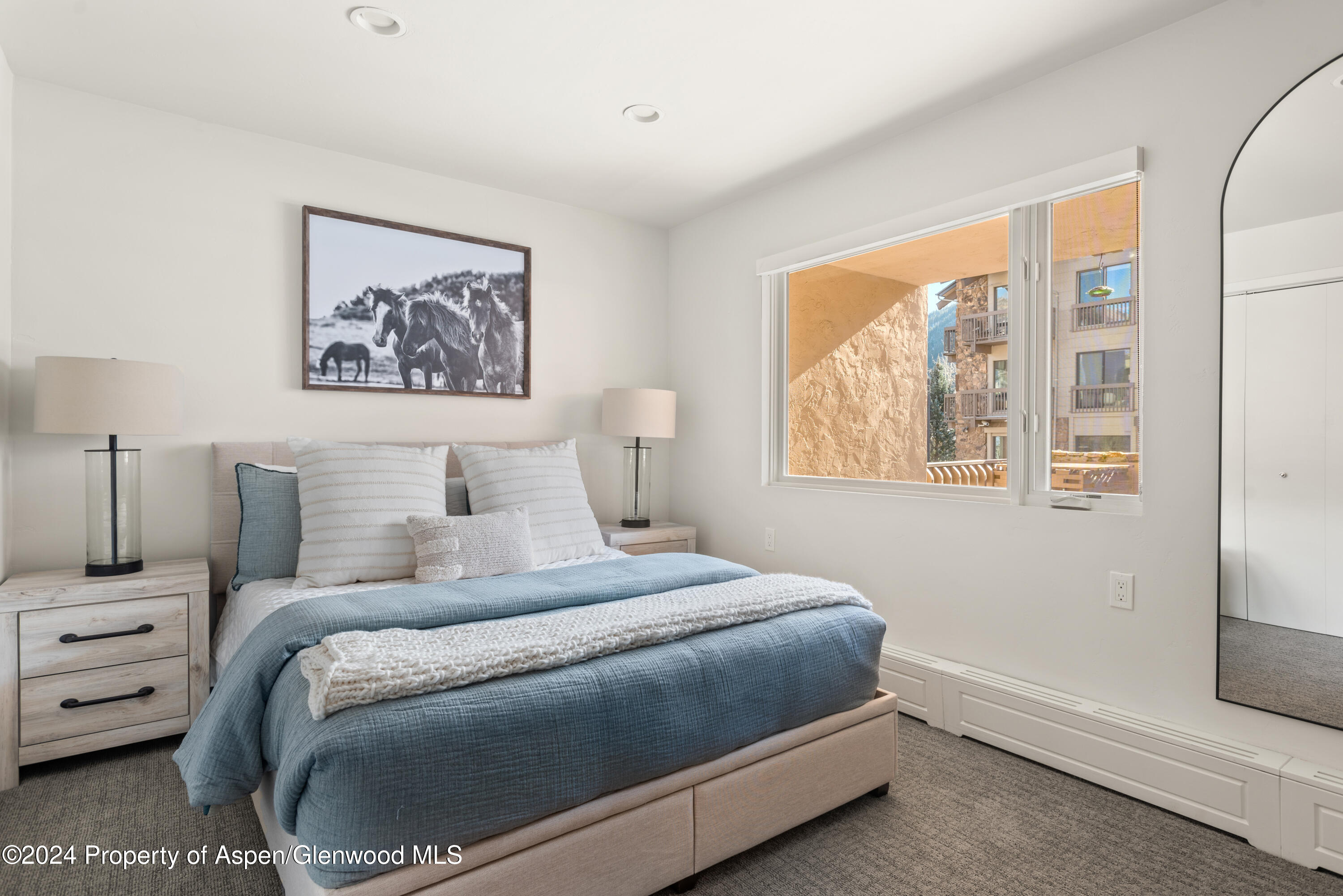 605 East Main Street, Unit 7 Aspen, CO 81611 - Photo 7 of 13 a bedroom with bed and a window