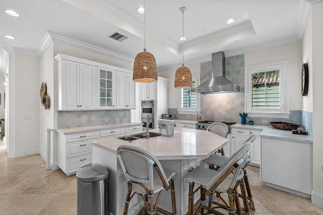a kitchen with stainless steel appliances a stove a sink and a refrigerator