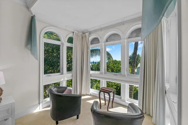 a bedroom with a bed and ceiling fan