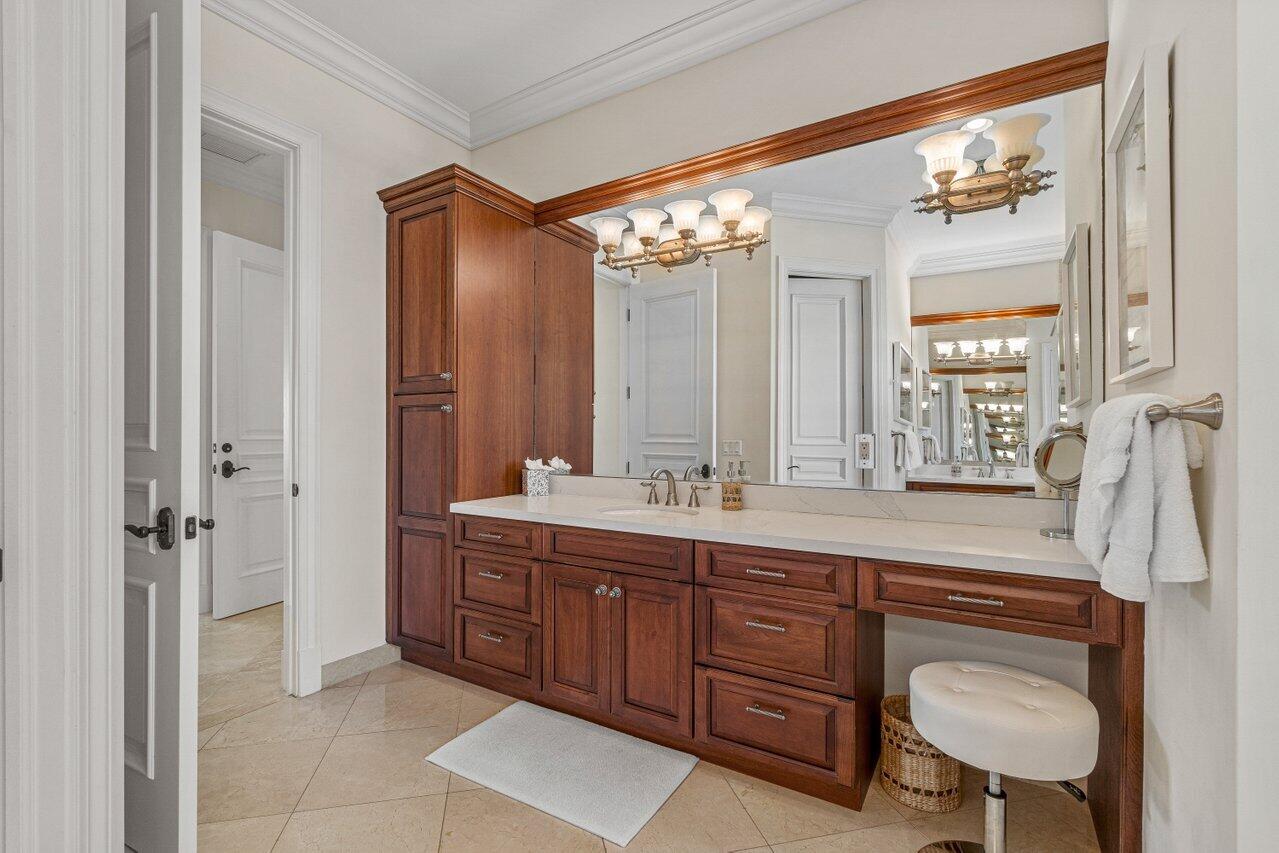 6103 North Ocean Boulevard Ocean Ridge, FL 33435 - Photo 30 of 53 a spacious bathroom with a granite countertop sink a mirror and a shower