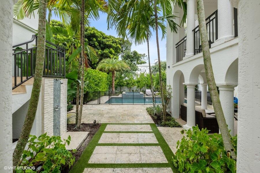 6103 North Ocean Boulevard Ocean Ridge, FL 33435 - Photo 47 of 53 a view of a pathway with house on both side