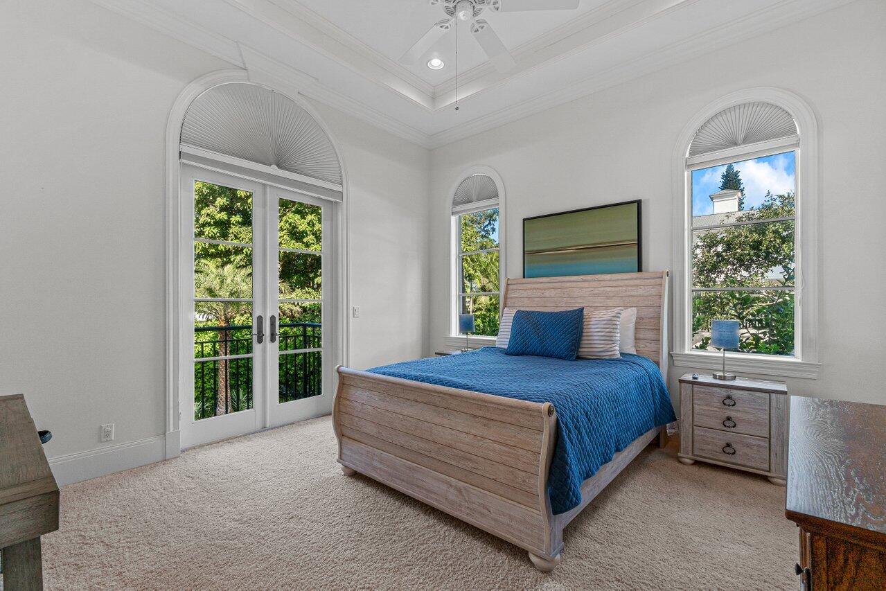 6103 North Ocean Boulevard Ocean Ridge, FL 33435 - Photo 9 of 53 a bedroom with a bed and window