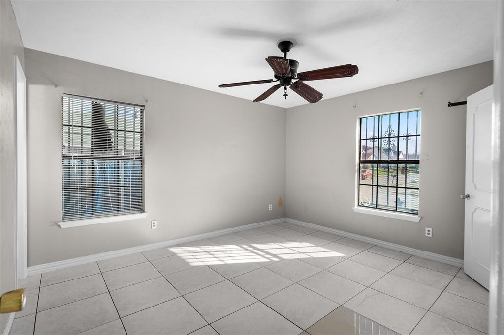 9319 Rutherglen Drive Dallas, TX 75227 - Photo 14 of 20 a view of empty room with windows