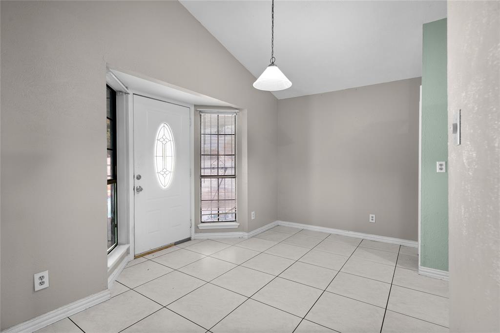 9319 Rutherglen Drive Dallas, TX 75227 - Photo 5 of 20 an empty room with windows and closet