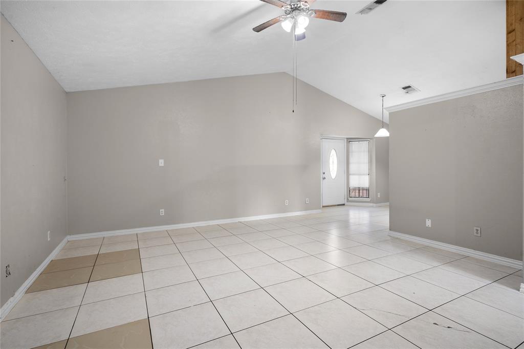9319 Rutherglen Drive Dallas, TX 75227 - Photo 7 of 20 a view of an empty room with a window