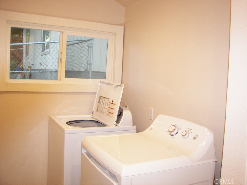 24977 Crest Forest Drive Crestline, CA 92325 - Photo 20 of 28 a utility room with dryer and washer