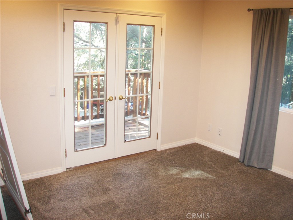24977 Crest Forest Drive Crestline, CA 92325 - Photo 4 of 28 an empty room with windows