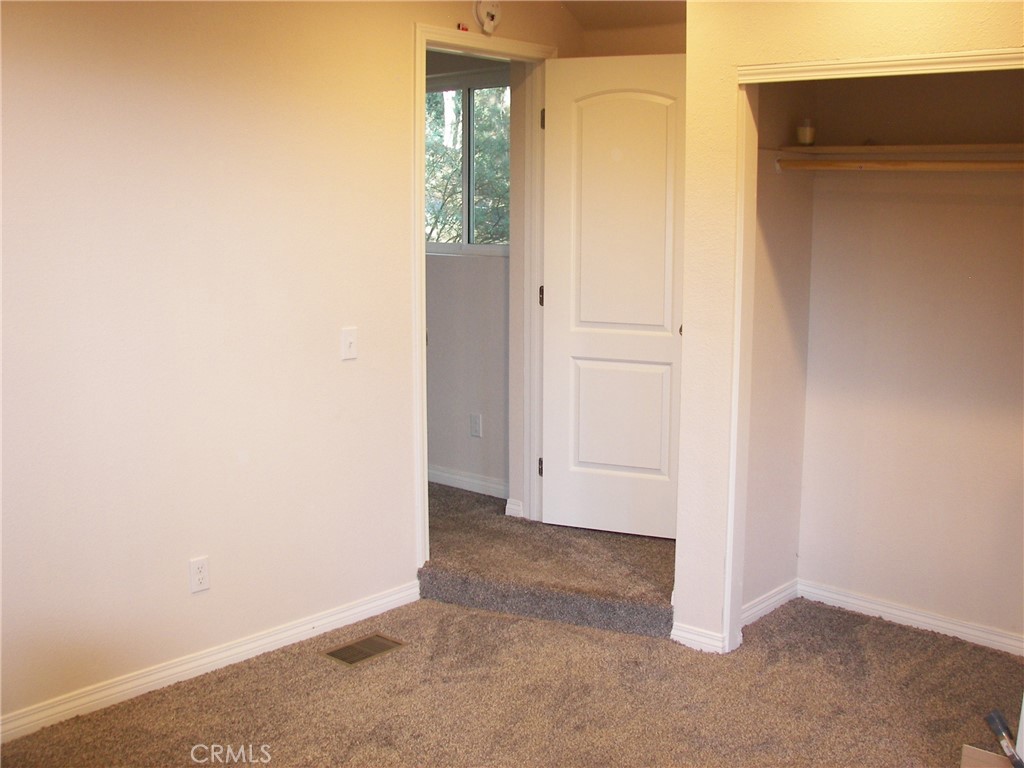 24977 Crest Forest Drive Crestline, CA 92325 - Photo 5 of 28 an empty room with windows