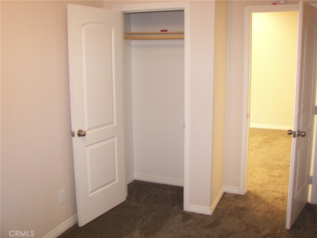 24977 Crest Forest Drive Crestline, CA 92325 - Photo 8 of 28 a view of a hallway with closet