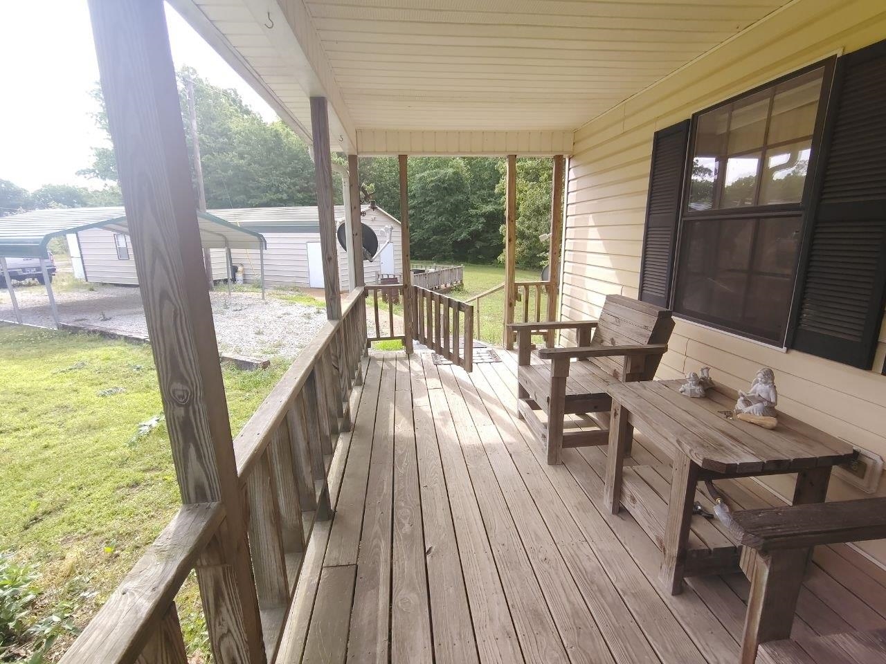1475 Authur Byrd Road Pocahontas, TN 38061 - Photo 4 of 37 Expansive covered front porch with wood-finish decking and railing