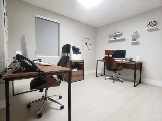 a view of a workspace with furniture