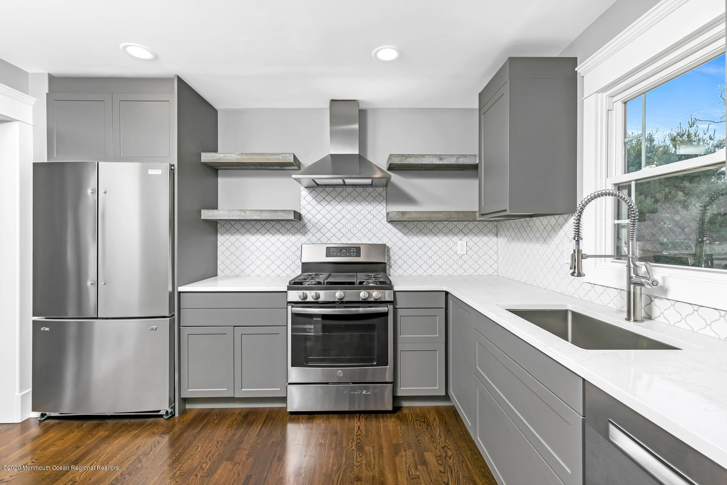 7 Hendrickson Place Fair Haven, NJ 07704 - Photo 1 of 14 a kitchen with stainless steel appliances granite countertop a sink stove and refrigerator