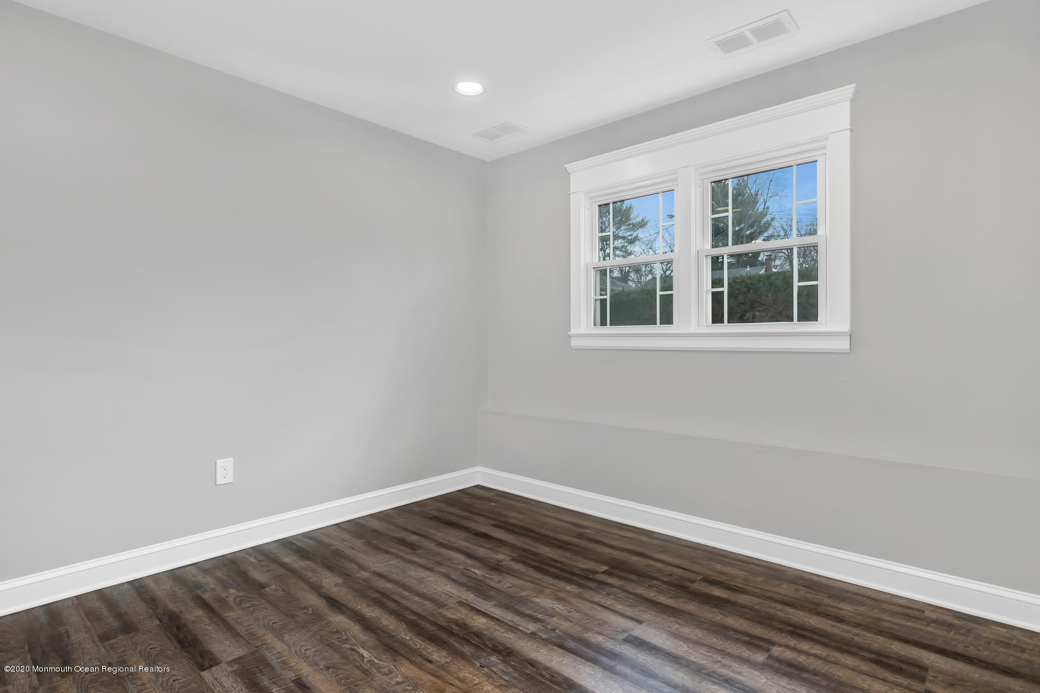 7 Hendrickson Place Fair Haven, NJ 07704 - Photo 11 of 14 a view of an empty room with wooden floor and a window