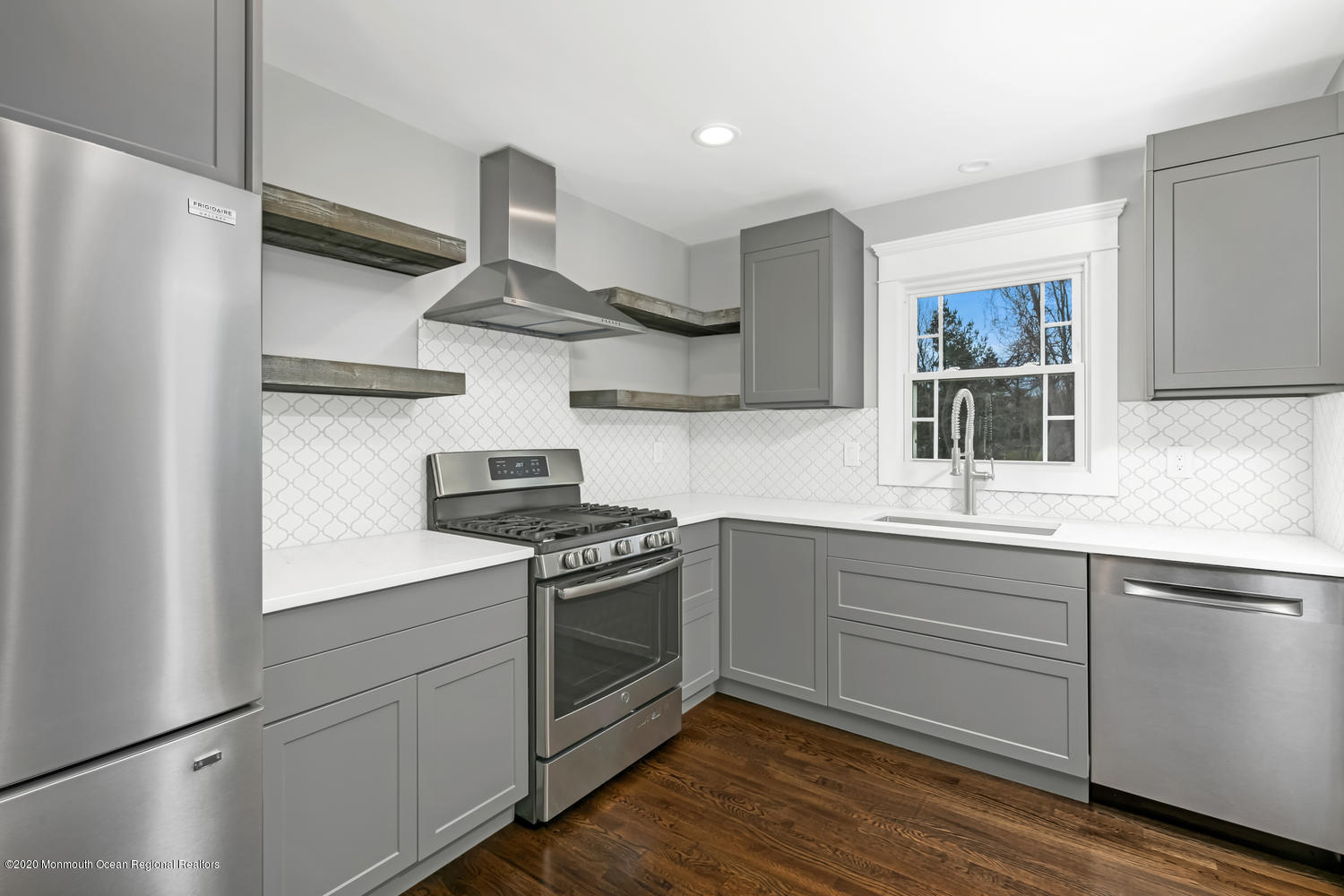 7 Hendrickson Place Fair Haven, NJ 07704 - Photo 3 of 14 a kitchen with stainless steel appliances granite countertop a stove and a sink