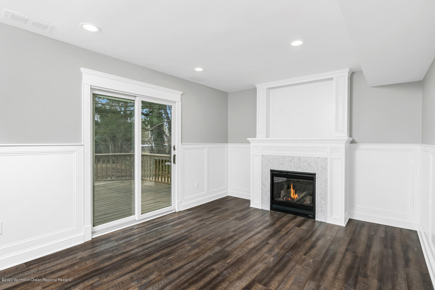 7 Hendrickson Place Fair Haven, NJ 07704 - Photo 7 of 14 a view of an empty room with wooden floor fireplace and a window