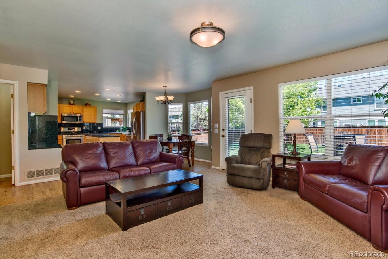 1757 Spring Water Place Highlands Ranch, CO 80129 - Photo 12 of 34 a living room with furniture and a large window
