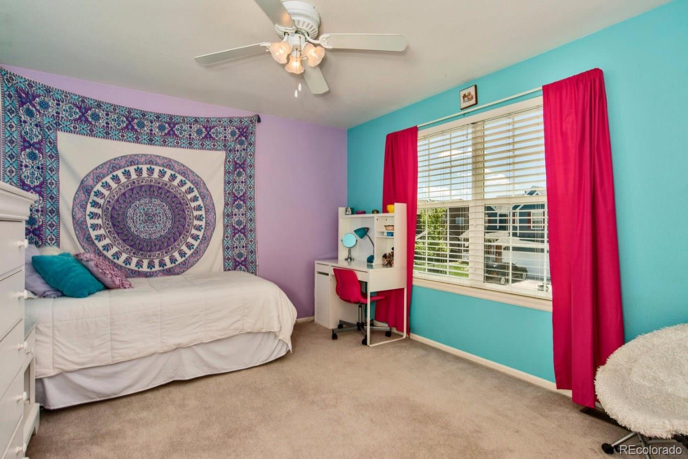 1757 Spring Water Place Highlands Ranch, CO 80129 - Photo 19 of 34 a bedroom with a bed and a window