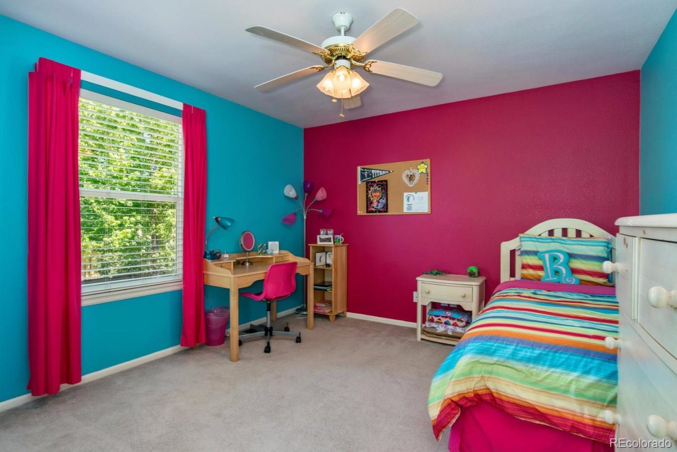 1757 Spring Water Place Highlands Ranch, CO 80129 - Photo 20 of 34 a bedroom with a bed and a chair