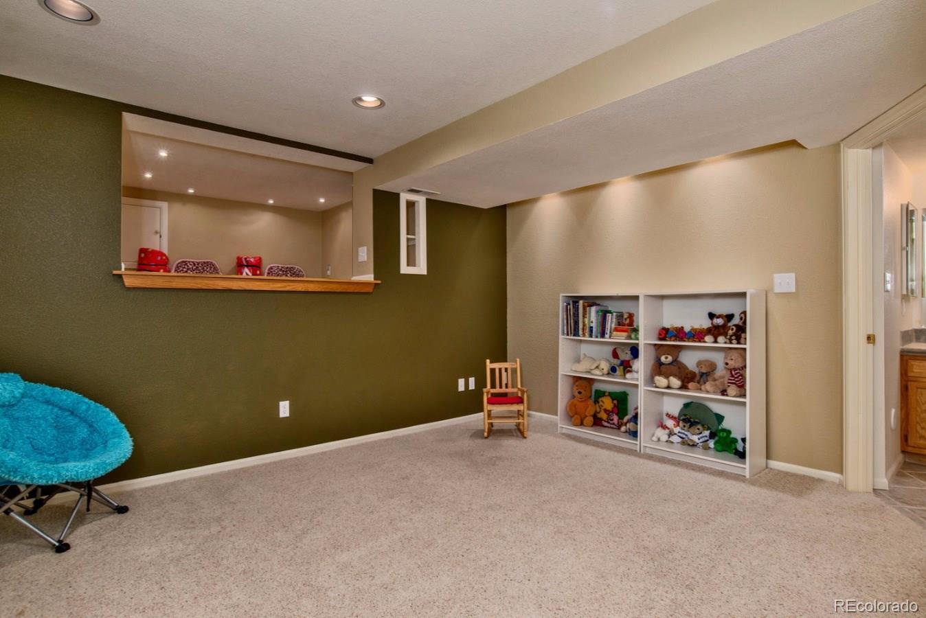 1757 Spring Water Place Highlands Ranch, CO 80129 - Photo 25 of 34 a view of a livingroom with shelves