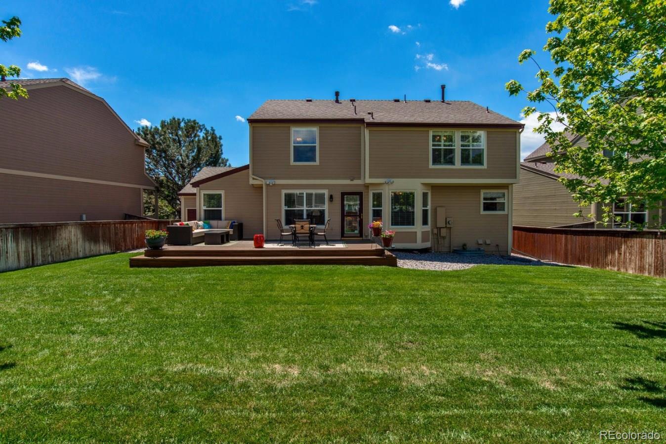 1757 Spring Water Place Highlands Ranch, CO 80129 - Photo 33 of 34 a view of a house with a backyard porch and sitting area
