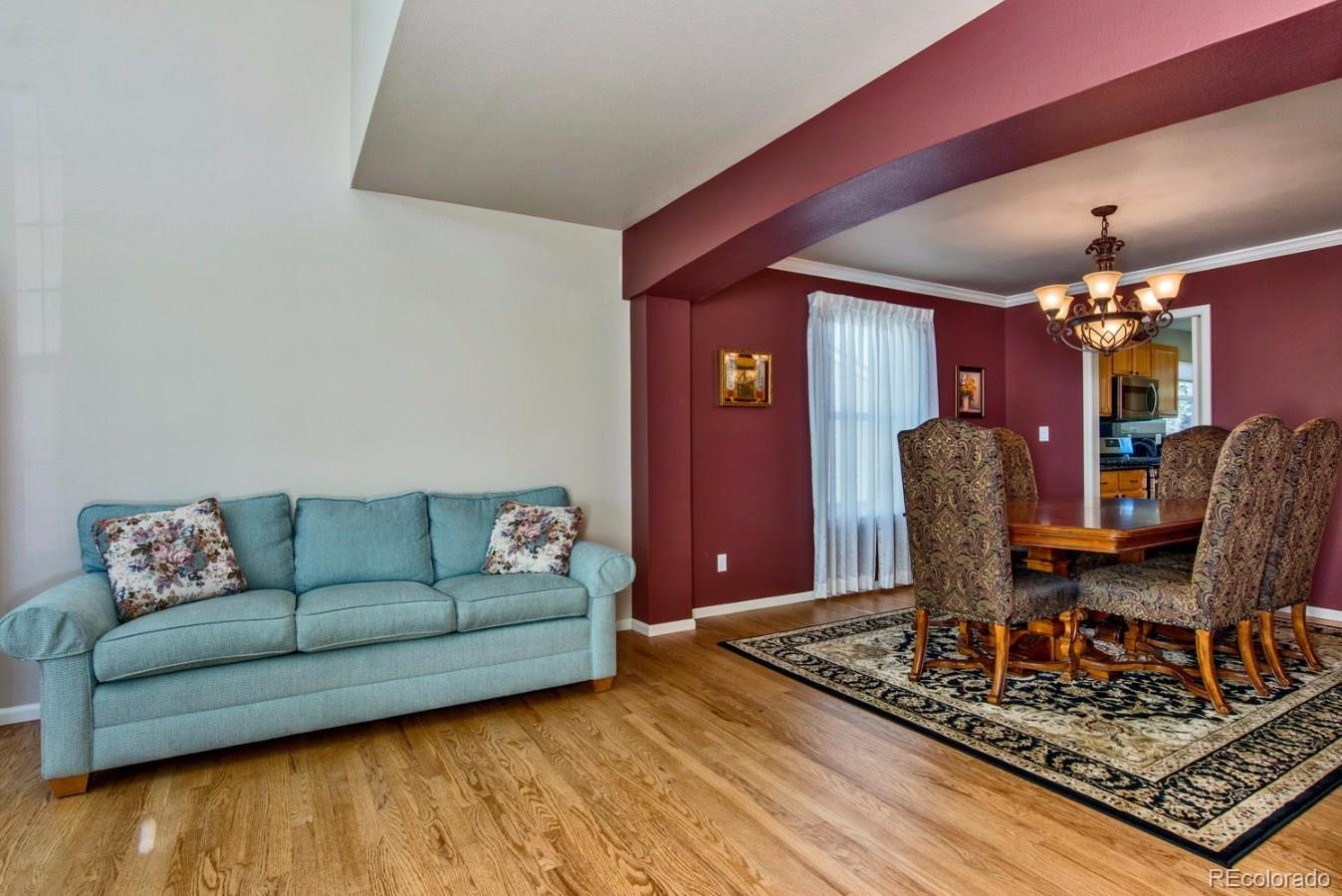 1757 Spring Water Place Highlands Ranch, CO 80129 - Photo 4 of 34 a living room with furniture and a rug