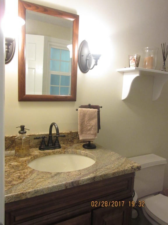 77 Autumn Road Lunenburg, MA 01462 - Photo 13 of 21 a bathroom with a granite countertop sink and a mirror