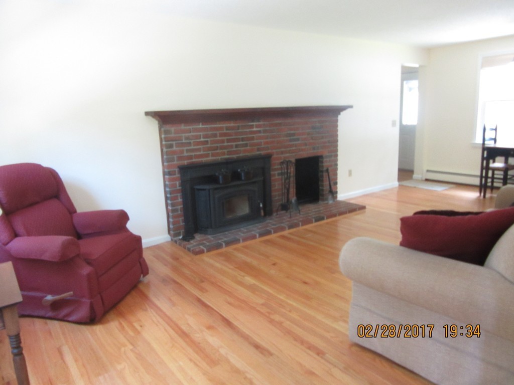 77 Autumn Road Lunenburg, MA 01462 - Photo 8 of 21 a living room with furniture and a fireplace