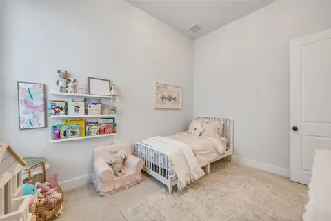 a bed room with two beds and a window