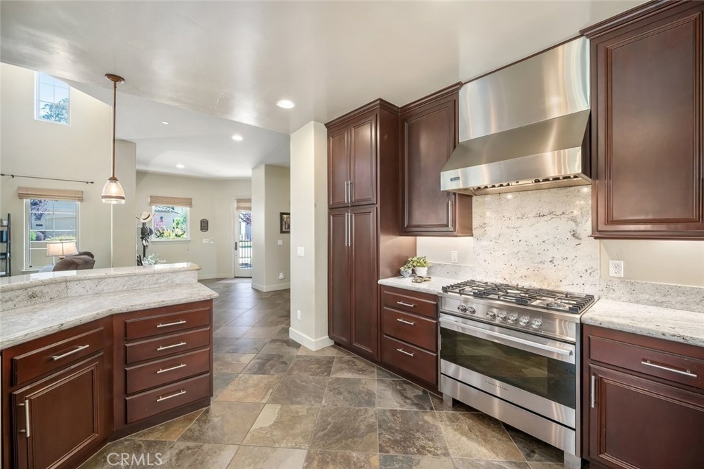 1602 Payton Way Nipomo, CA 93444 - Photo 11 of 71 a kitchen with stainless steel appliances granite countertop a stove and a refrigerator