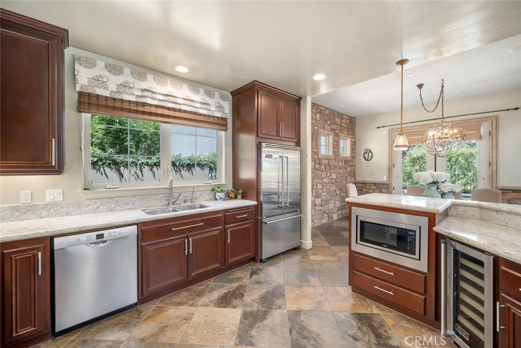1602 Payton Way Nipomo, CA 93444 - Photo 13 of 71 a kitchen with stainless steel appliances granite countertop a sink stove and refrigerator