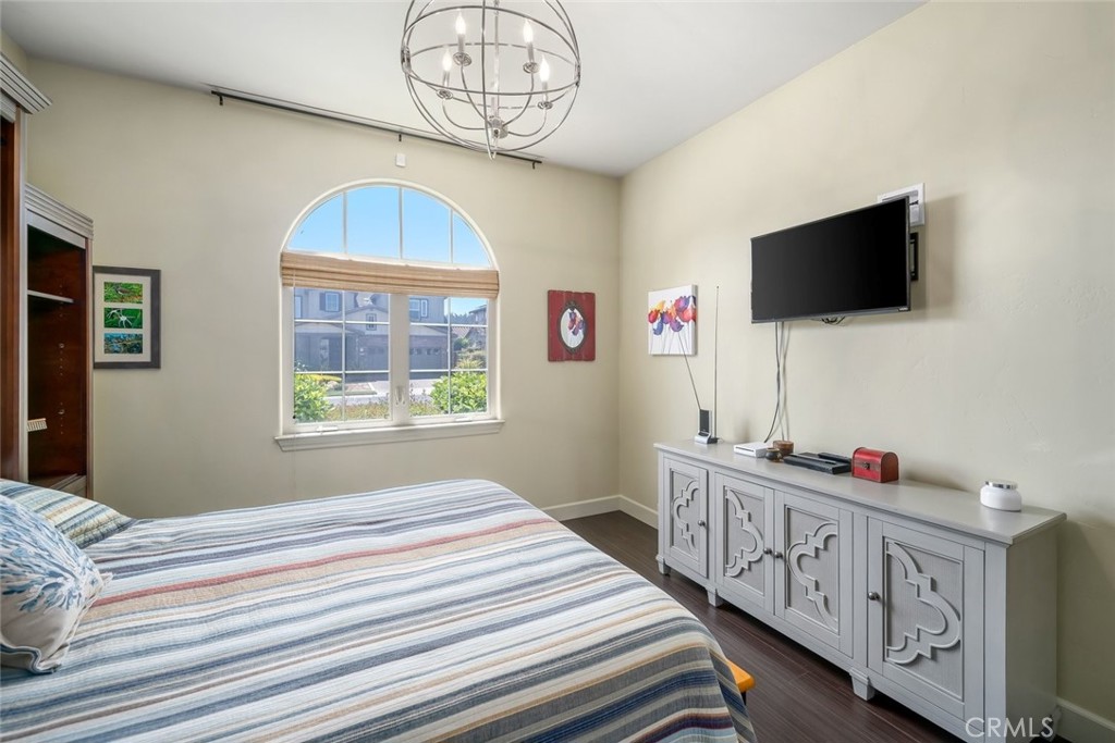 1602 Payton Way Nipomo, CA 93444 - Photo 36 of 71 a bedroom with furniture a flat screen tv and a window