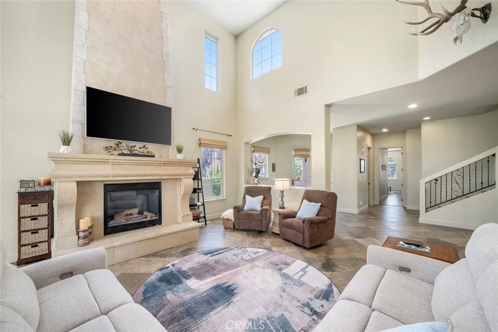 1602 Payton Way Nipomo, CA 93444 - Photo 6 of 71 a living room with furniture a flat screen tv and a fireplace