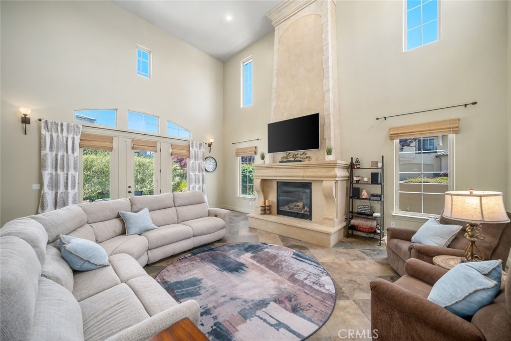 1602 Payton Way Nipomo, CA 93444 - Photo 7 of 71 a living room with furniture a fireplace and a flat screen tv
