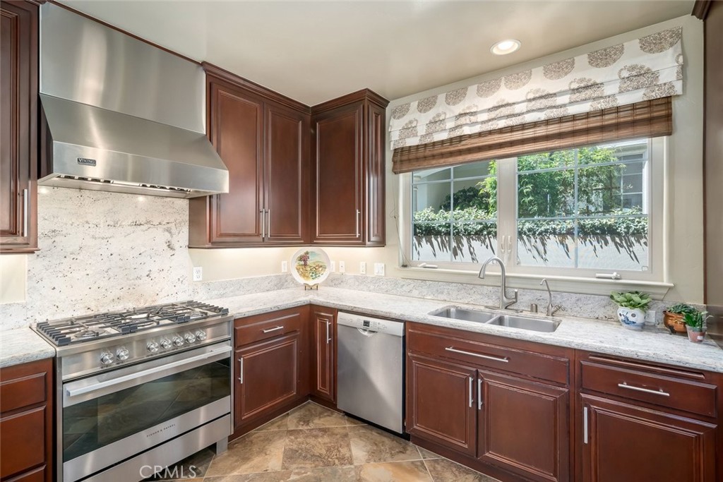 1602 Payton Way Nipomo, CA 93444 - Photo 10 of 71 a kitchen with a sink stove top oven and cabinets