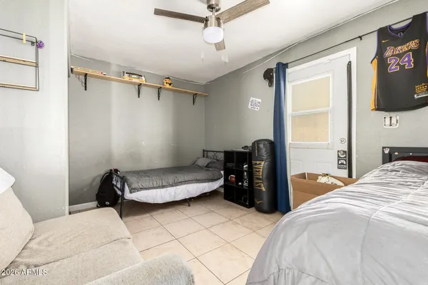 a bedroom with a bed and a chandelier