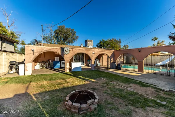 a view of yard with swimming pool and porch